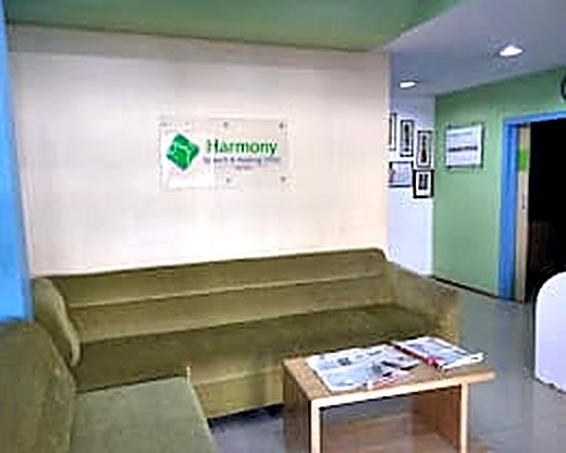 Reception and waiting area with the Harmony sign